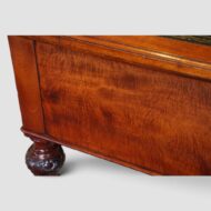 Victorian mahogany writing table by Holland & Sons with green leather writing surface and nine drawers.