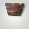 Close‑up of iron strapping on antique trunk