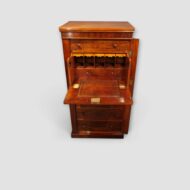 Antique Wellington chest showing secretaire drawer interior