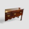 Georgian oak dresser base with turned legs at angle