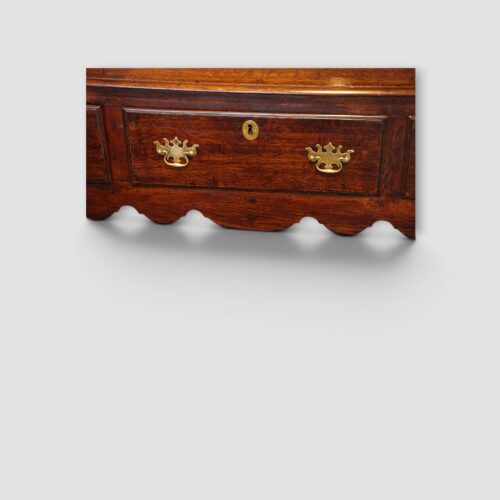 18th‑century oak dresser base showing shaped apron detail
