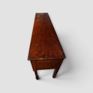 Antique Georgian dresser base with turned front legs