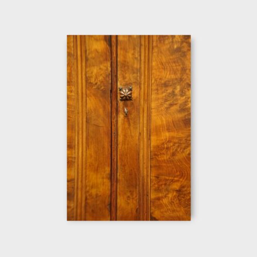 Antique walnut linen press with panelled doors